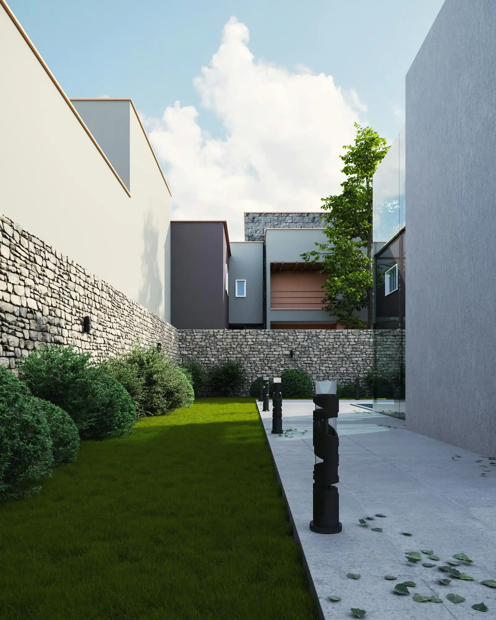 A narrow side garden between modern houses: clipped shrubs, a strip of lawn and a dry-stone wall