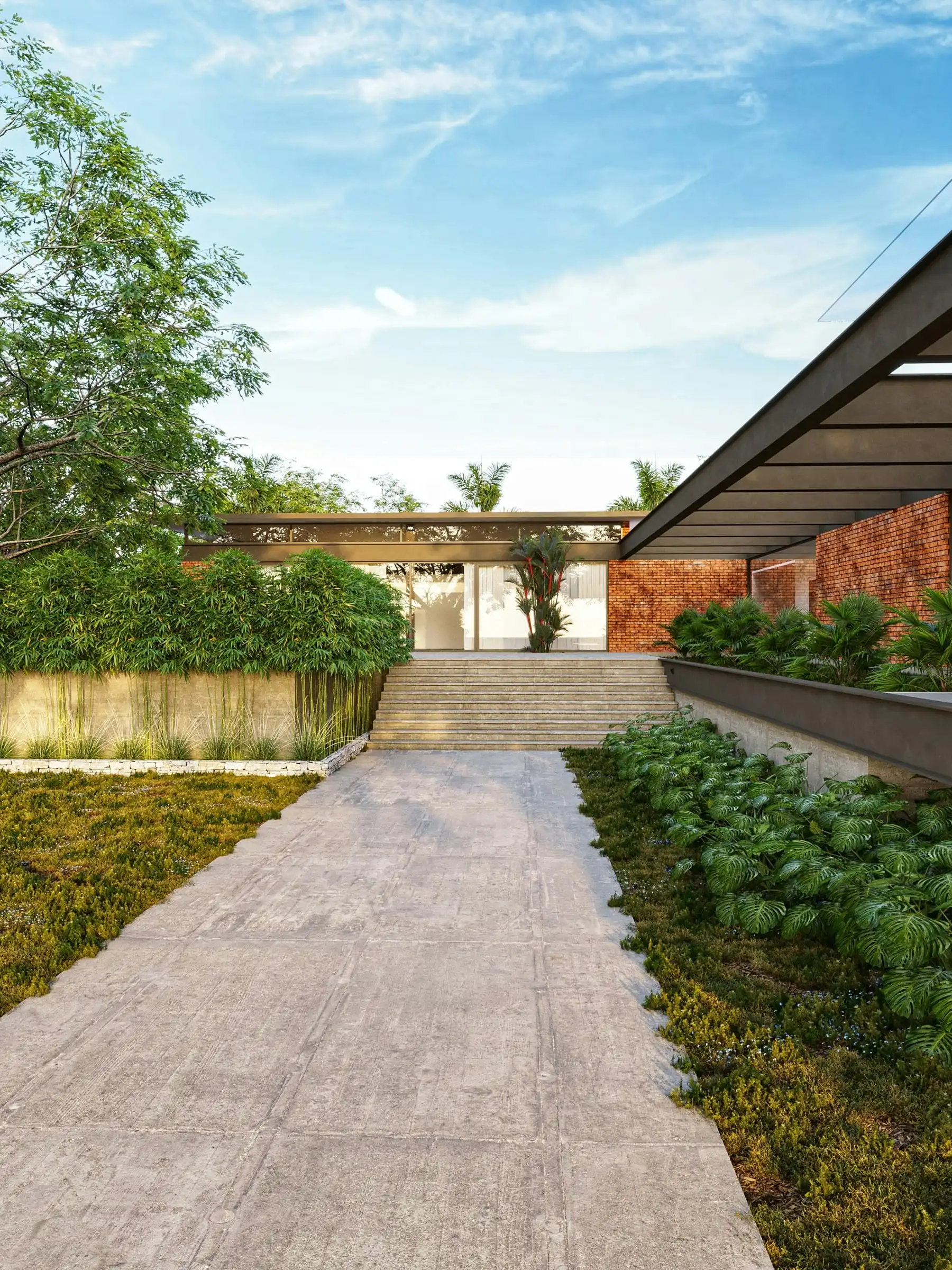 A long paved courtyard with low planting either side, leading to a glass-fronted house